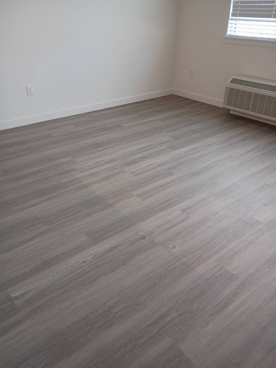 Clean grey vinyl floor in empty room